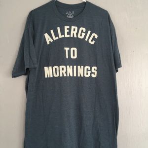 JEM shirt that says “Allergic to mornings”